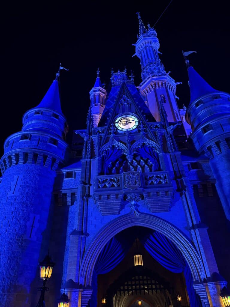 Magic Kingdom castle at night can be enjoyed at night by maximizing points for a budget trip