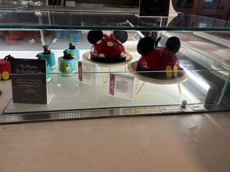 Family decorating Mickey Mouse cake at Amorette's cake decorating class