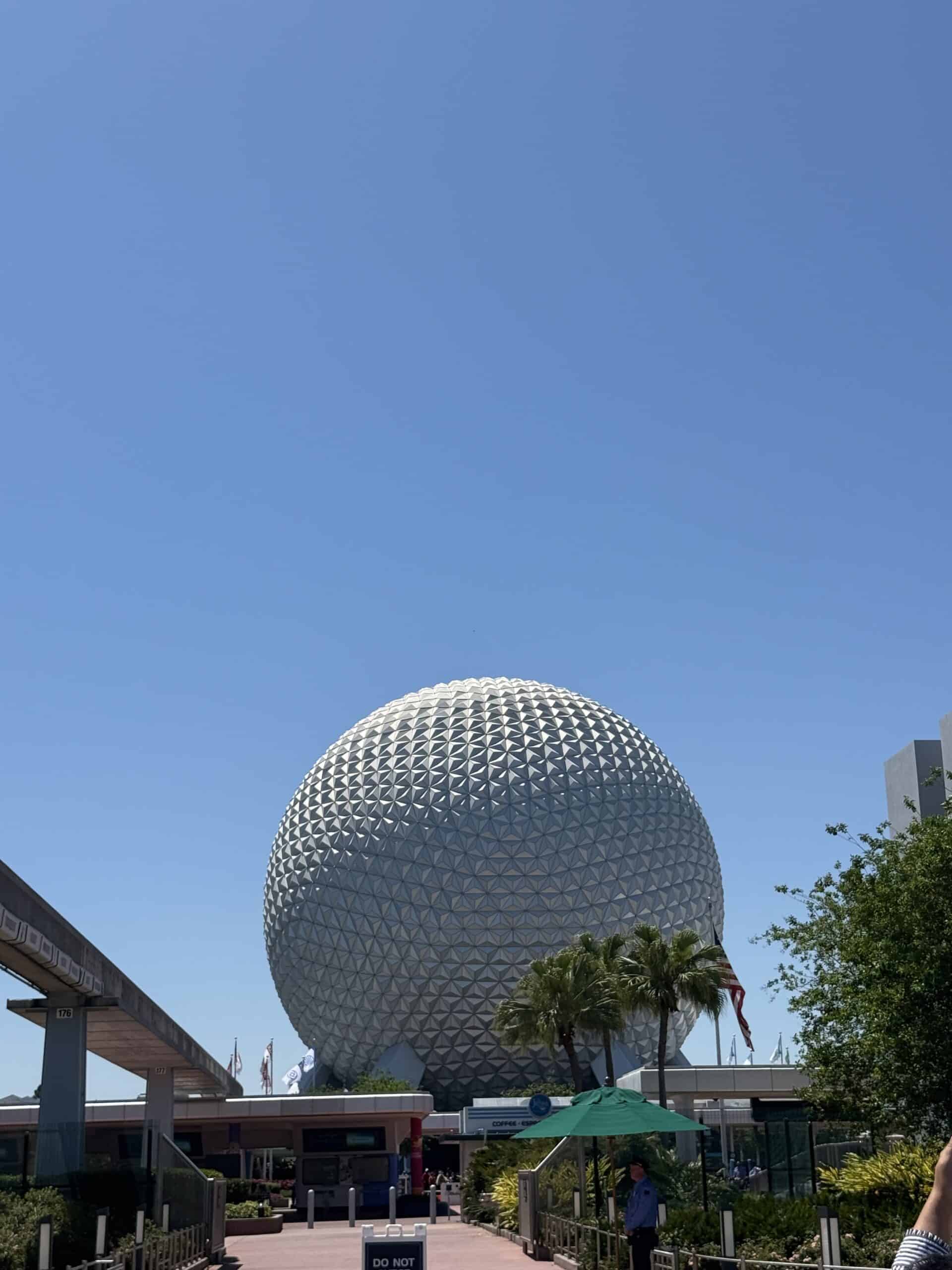 Spaceship Earth at EPCOT under clear blue sky Disney World