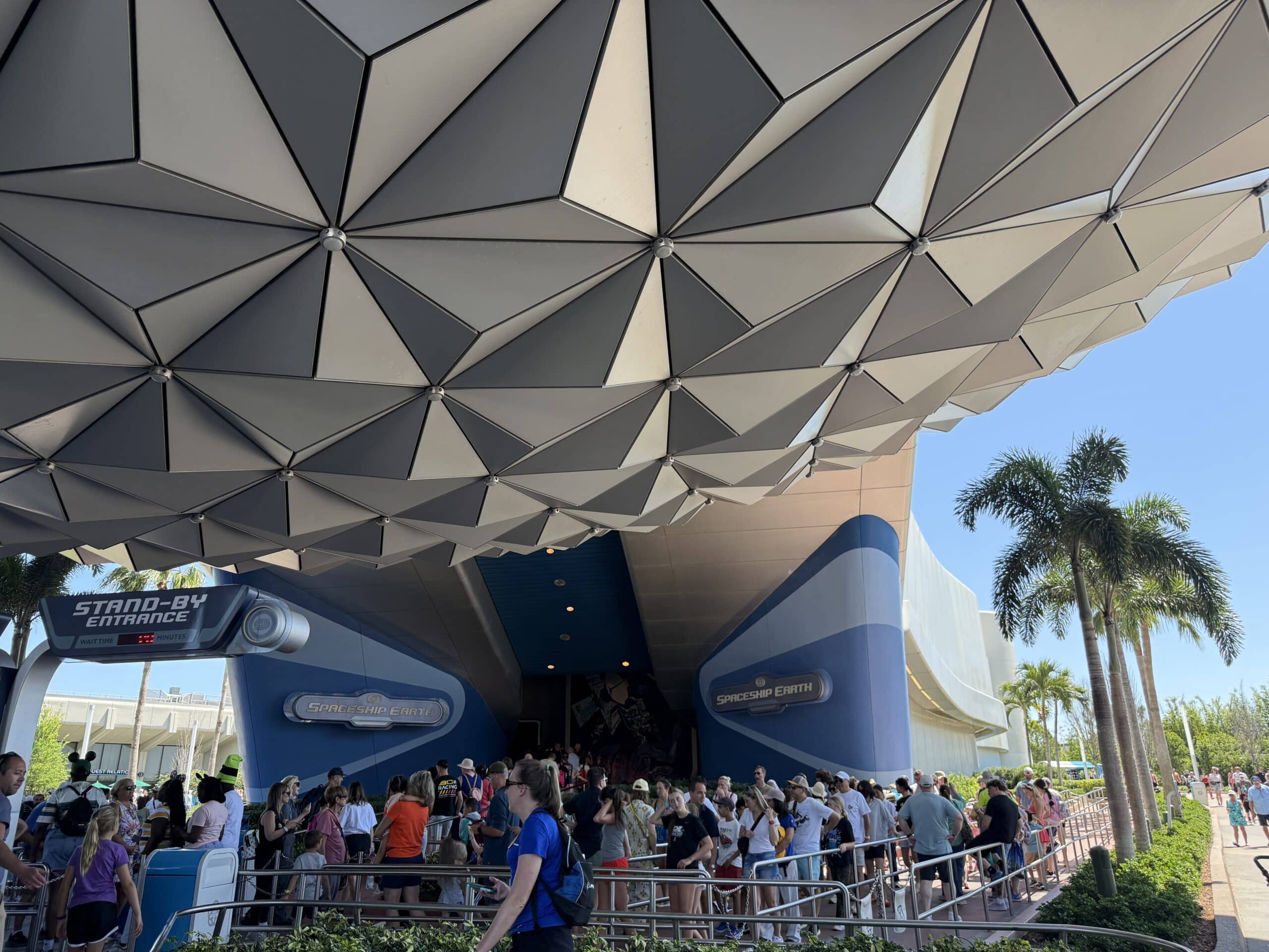 EPCOT entrance structure with guests entering park Disney World