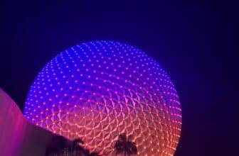 EPCOT Spaceship Earth glowing purple at night Disney World trip